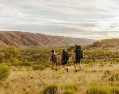 Photo of three backpackers in the outback.