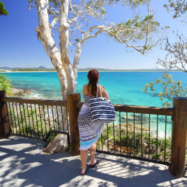 Lady on a Noosa Beach lookout.