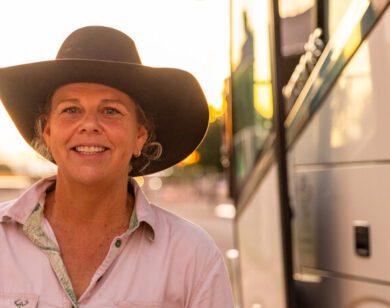 Regional Australian Lady outside of a Greyhound Coach